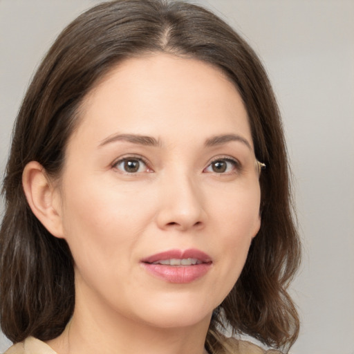 Joyful white young-adult female with medium  brown hair and brown eyes