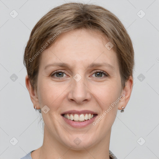 Joyful white young-adult female with short  brown hair and grey eyes