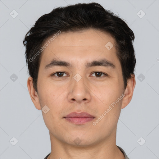 Joyful white young-adult male with short  black hair and brown eyes