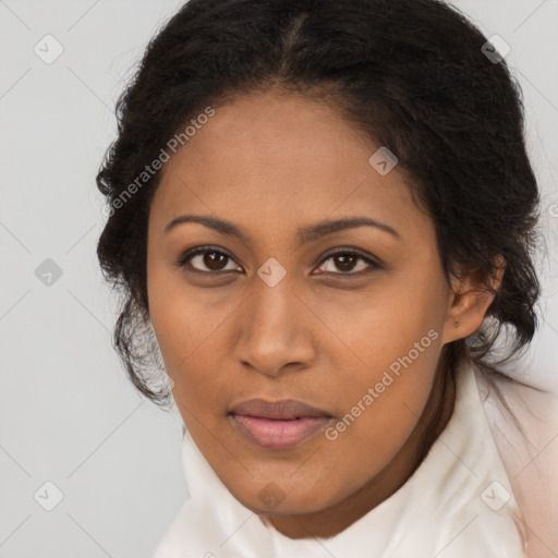 Joyful black young-adult female with long  brown hair and brown eyes