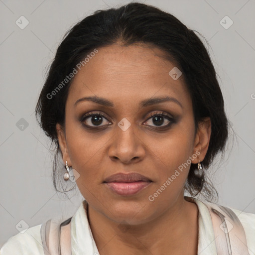 Joyful black young-adult female with medium  brown hair and brown eyes
