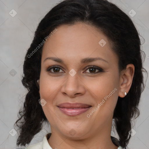 Joyful black adult female with medium  brown hair and brown eyes