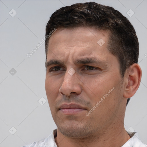 Joyful white adult male with short  brown hair and brown eyes