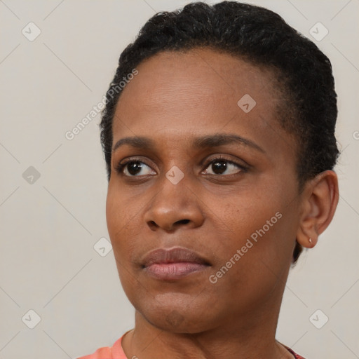 Neutral black young-adult female with short  brown hair and brown eyes