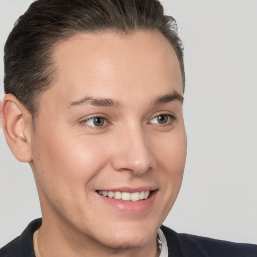 Joyful white young-adult male with short  brown hair and brown eyes