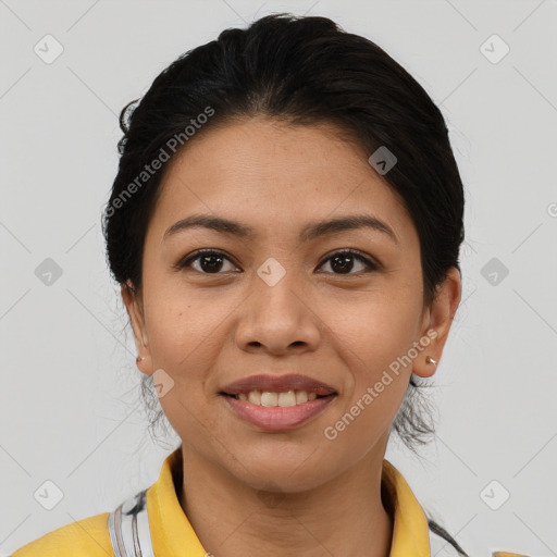 Joyful latino young-adult female with short  brown hair and brown eyes