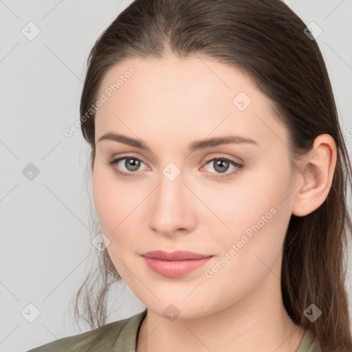 Neutral white young-adult female with long  brown hair and brown eyes