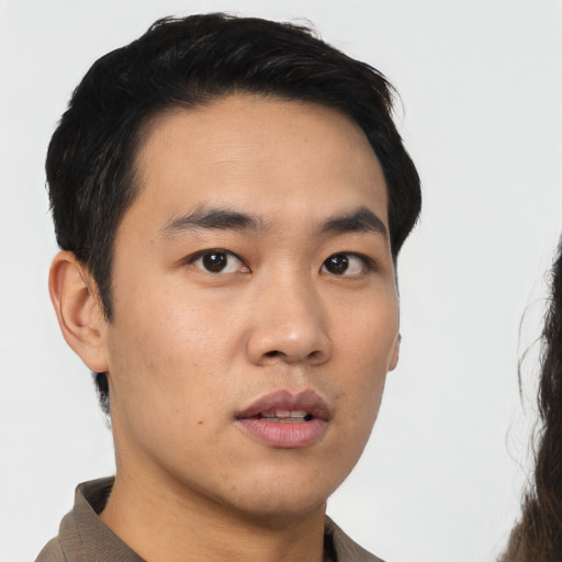 Neutral asian young-adult male with short  black hair and brown eyes