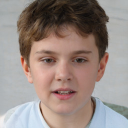 Joyful white child male with short  brown hair and brown eyes
