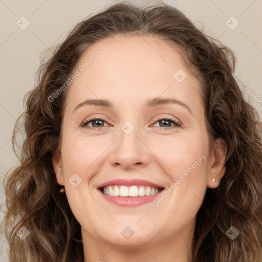 Joyful white young-adult female with long  brown hair and green eyes