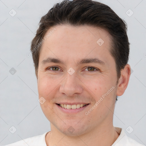 Joyful white young-adult male with short  brown hair and brown eyes