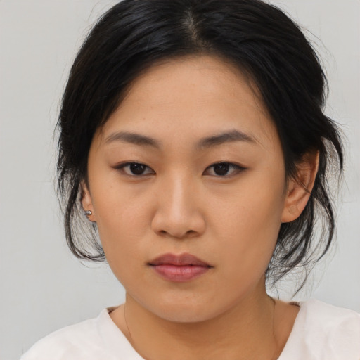 Neutral asian young-adult female with medium  black hair and brown eyes