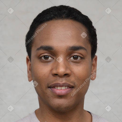 Joyful black young-adult male with short  black hair and brown eyes