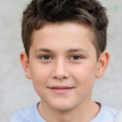 Joyful white child male with short  brown hair and brown eyes