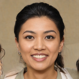 Joyful asian young-adult female with medium  brown hair and brown eyes