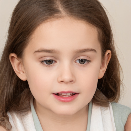 Joyful white child female with medium  brown hair and brown eyes