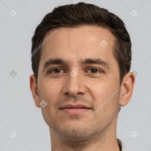 Joyful white adult male with short  brown hair and brown eyes