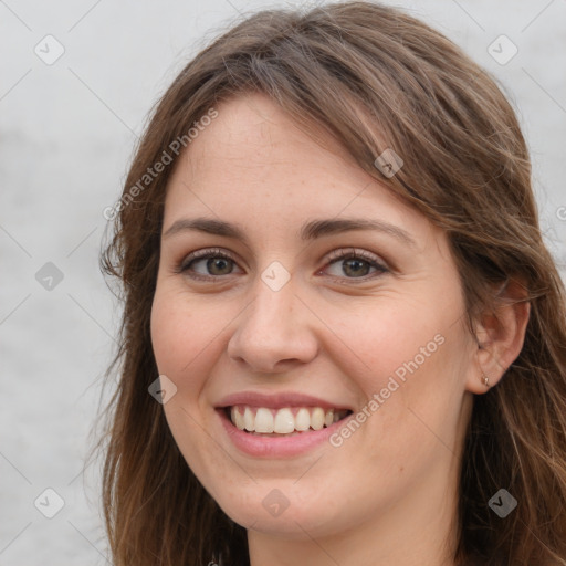 Joyful white young-adult female with long  brown hair and grey eyes