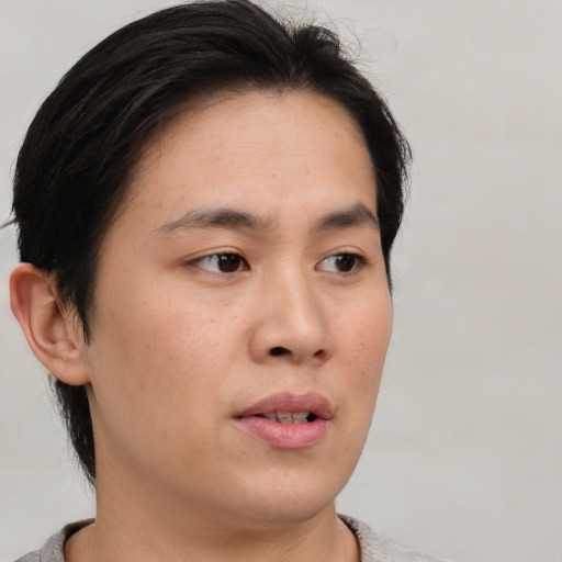 Neutral asian young-adult male with short  brown hair and brown eyes