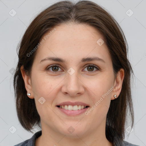 Joyful white adult female with medium  brown hair and brown eyes