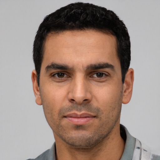 Neutral white young-adult male with short  black hair and brown eyes