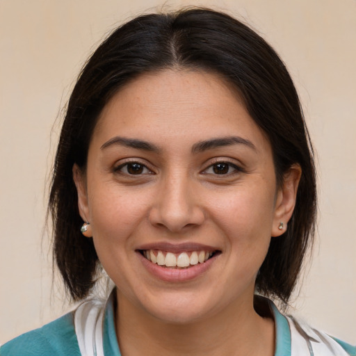 Joyful white young-adult female with medium  brown hair and brown eyes