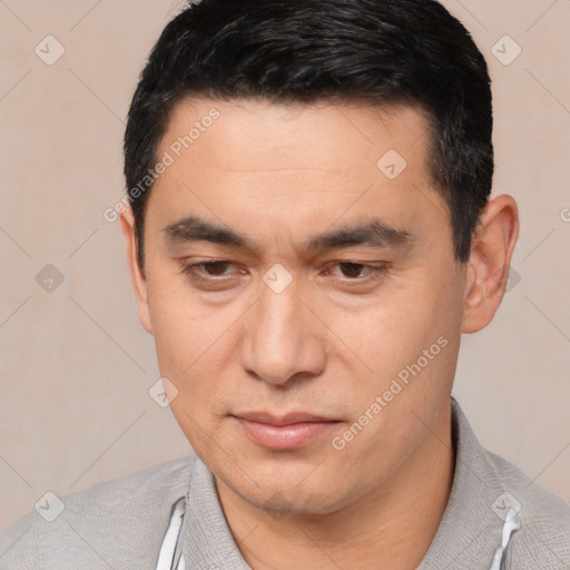 Joyful white young-adult male with short  black hair and brown eyes