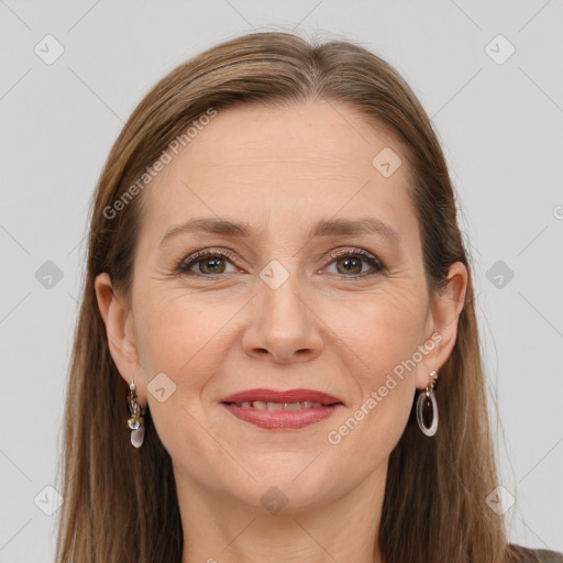 Joyful white adult female with long  brown hair and grey eyes