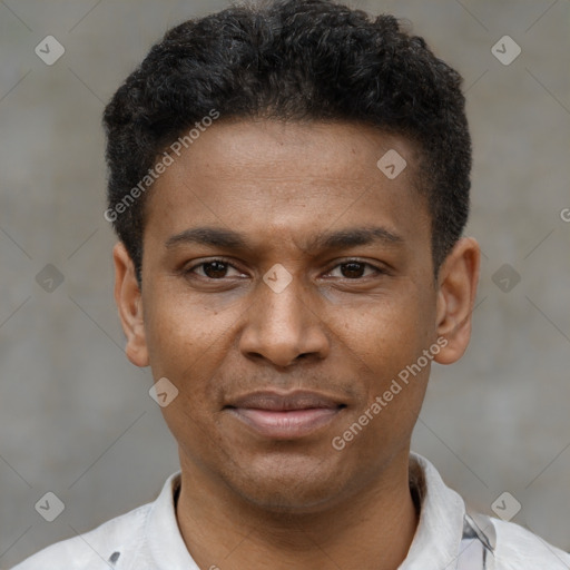 Joyful latino young-adult male with short  brown hair and brown eyes
