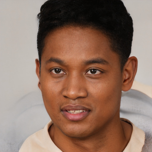 Joyful black young-adult male with short  black hair and brown eyes