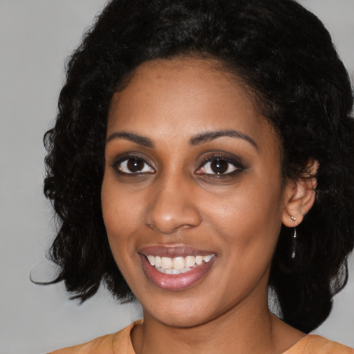 Joyful latino young-adult female with medium  black hair and brown eyes