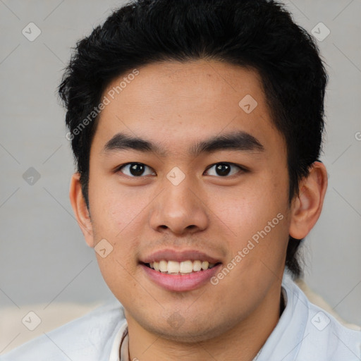 Joyful asian young-adult male with short  black hair and brown eyes