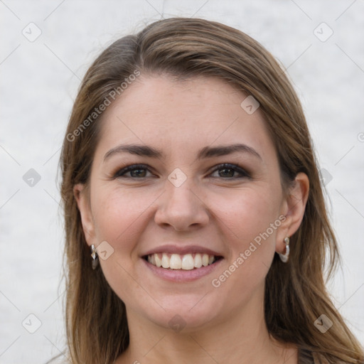 Joyful white young-adult female with long  brown hair and grey eyes