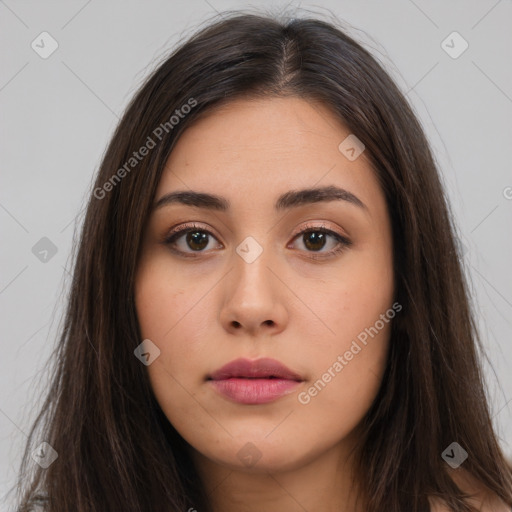 Neutral white young-adult female with long  brown hair and brown eyes