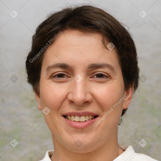 Joyful white adult female with short  brown hair and brown eyes