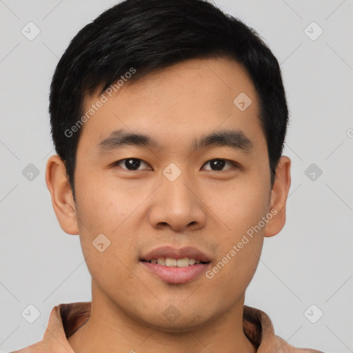 Joyful asian young-adult male with short  black hair and brown eyes