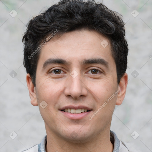 Joyful white young-adult male with short  black hair and brown eyes