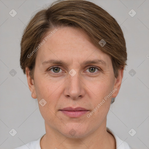 Joyful white adult female with short  brown hair and grey eyes