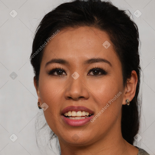Joyful asian young-adult female with medium  brown hair and brown eyes