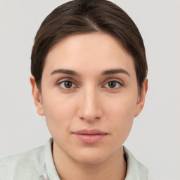 Neutral white young-adult female with short  brown hair and brown eyes