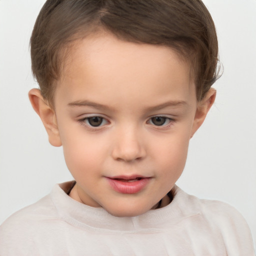 Joyful white child female with short  brown hair and brown eyes