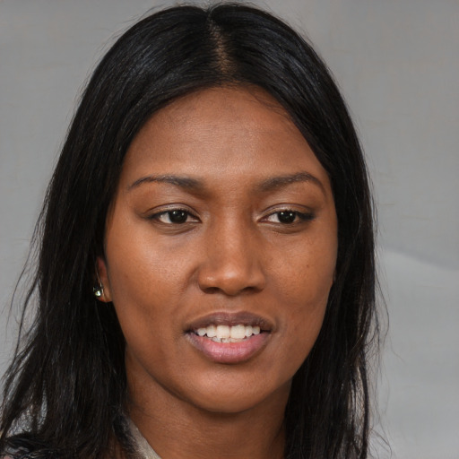 Joyful asian young-adult female with long  brown hair and brown eyes