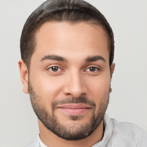 Joyful white young-adult male with short  brown hair and brown eyes