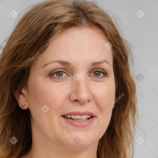 Joyful white adult female with long  brown hair and green eyes