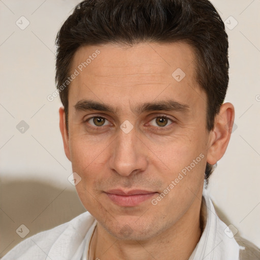 Joyful white adult male with short  brown hair and brown eyes