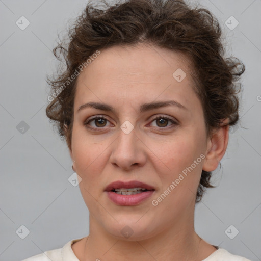 Joyful white adult female with medium  brown hair and brown eyes