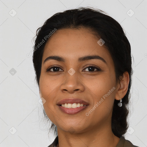 Joyful latino young-adult female with long  black hair and brown eyes