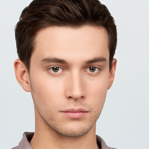 Neutral white young-adult male with short  brown hair and brown eyes