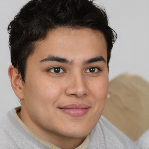 Joyful latino young-adult male with short  brown hair and brown eyes