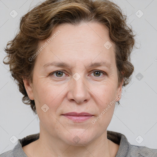 Joyful white adult female with medium  brown hair and blue eyes